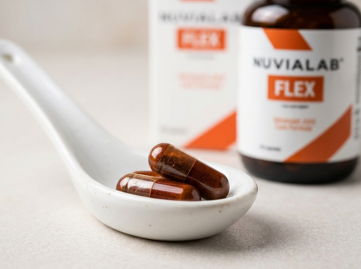 NuviaLab Flex capsules resting on a spoon showing the daily 2-capsule dose